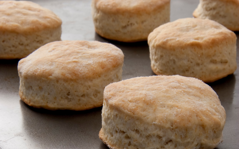 Six biscuits made from baking powder showcased on a tabletop